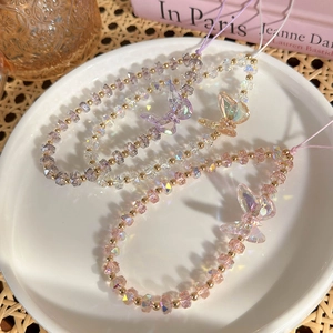 Détails de trois dragonnes de téléphone en cristal coloré avec breloques papillon irisées
