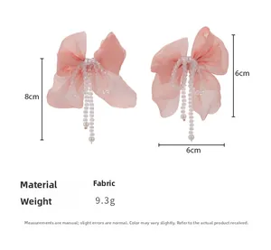 Pink chiffon bow hair clips with white pearls and long beaded tassels shown with dimensions