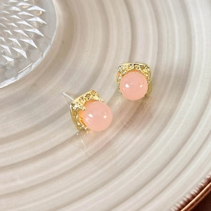 Detail of pink translucent bead earrings with gold hammered texture square base