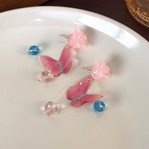 Elegant pink resin rose earrings with butterfly wings and sparkling crystal beads