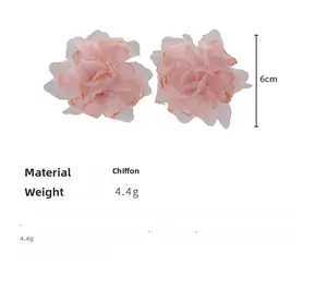 Detailed view of pink chiffon fabric flower earrings with 6cm diameter and soft texture