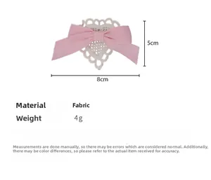 Pink ribbon bow and white crochet lace heart hair clip showing 8cm x 5cm dimensions