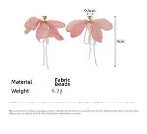 Pink fabric flower tassel earrings with golden heart studs and white beaded fringe detail