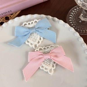Elegant bow hair clips set with heart lace trim in pastel pink and blue colors