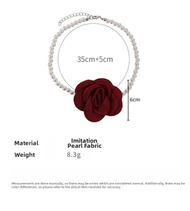 Detail view of pearl necklace with a 6cm burgundy satin rose charm and 35cm chain