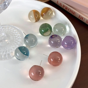 Minimalist translucent resin ball stud earrings in amber, green, blue, purple, and pink