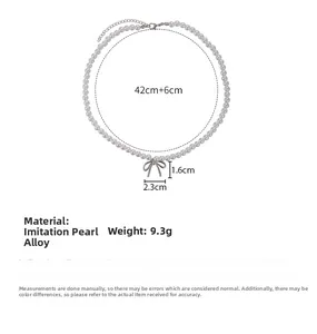 Detail view of pearl necklace with silver bow pendant, 42cm length and 6cm extension