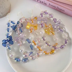 Colorful beaded phone strap set with translucent bow charms in diverse vibrant colors