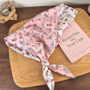 Pink dog print cotton headscarf with double-sided design on a decorative wooden tray