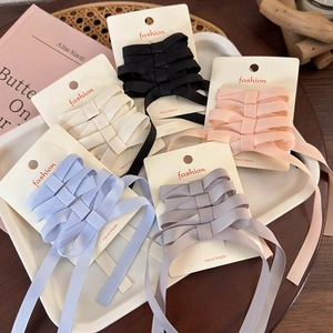 Set of five ribbed ribbon bow hair clips in assorted colors on display cards