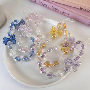 Colorful clear beaded phone lanyards with acrylic bows in blue pink and purple