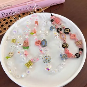 Bijoux de téléphone faits main avec perles colorées, fleurs, papillons et étoiles