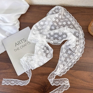 White lace floral headscarf bandana with embroidery on a rustic wooden background