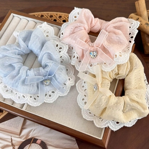 Set of three lace bow scrunchies with heart rhinestones in blue, pink, and yellow colors