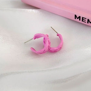Detail showing pink quilted texture and C-shape design on trendy metal hoop earrings