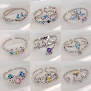 Collection of nine geometric open rings with colorful cubic zirconia in S925 silver finish