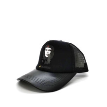 Detail of black trucker hat featuring Che Guevara portrait with leather brim and mesh back