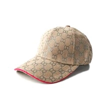 Detail view of khaki baseball cap with G interlocking pattern and red brim accent