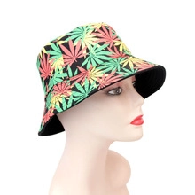 Detail view of double-sided fisherman hat with vibrant multi-color leaf patterns