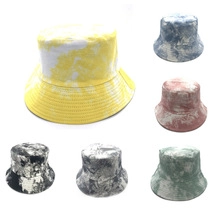 Detail view of tie-dye bucket hats in six colors with reinforced brim stitching