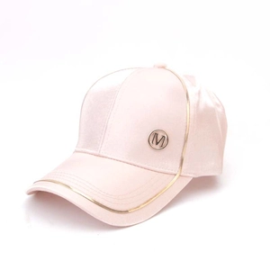 Pink satin baseball cap for women with gold trim and metal M logo on white background