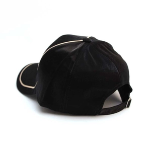 Black and beige baseball cap with adjustable metal buckle shown from a rear side view