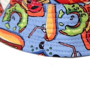 Detailed macro view of twill cotton bucket hat with blue cartoon pop art food print