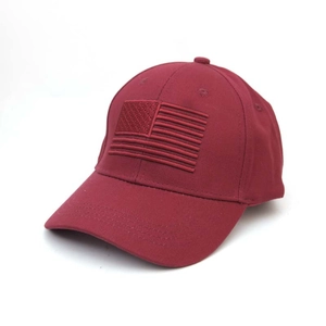 Detailed embroidery of American flag on dark red baseball cap with cotton texture