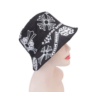 Close-up of black cotton bucket hat featuring white cross and gothic letter prints