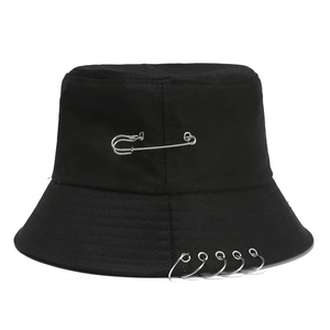 Punk black cotton bucket hat featuring a silver safety pin and five metal rings