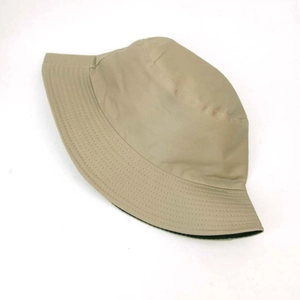 Detail of khaki twill cotton bucket hat showing reinforced brim stitching and black lining