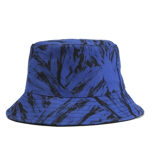 Royal blue bucket hat with black abstract brush strokes pattern for outdoor sun protection