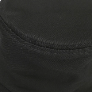 Detailed macro view of black cotton bucket hat showing neat double stitching on top