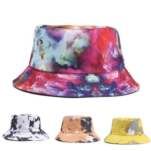 Detail view of multi-color bucket hats with marble, tie-dye, and abstract prints