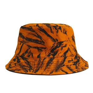 Orange bucket hat with black abstract brushstroke pattern for sun protection outdoors