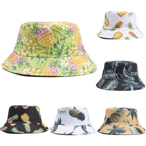 Close-up showing six styles of tropical fruit print cotton bucket hats for summer sun protection