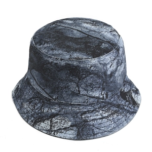 Unisex tie-dye bucket hat featuring black and grey marble print on white background