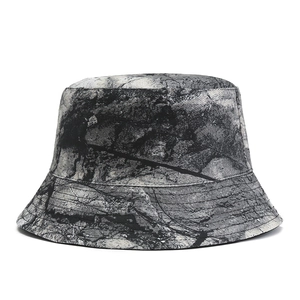 Close-up of marble pattern bucket hat featuring detailed brim stitching and canvas texture
