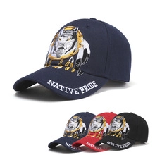 Detail of Native Pride baseball caps with embroidered Indian profile and feather designs