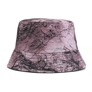 Detailed macro view of pink and black marble pattern on high-quality canvas bucket hat