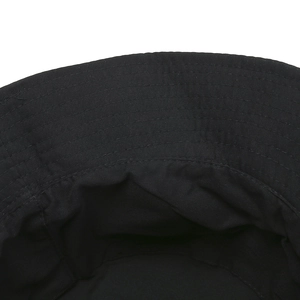 Detailed view of the black cotton bucket hat interior with reinforced stitching lines