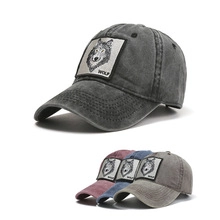 Detailed view of washed cotton baseball caps with wolf patch in four vintage colors