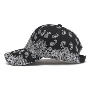 Close-up of black baseball cap with white paisley print on high-quality twill fabric