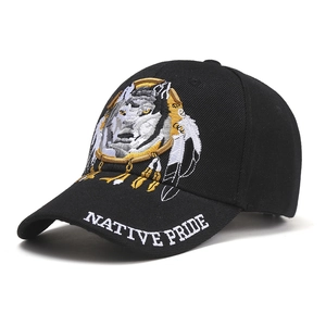Detail showing wolf head embroidery and Native Pride text on a black baseball cap