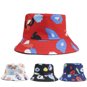 Detailed view of bucket hat featuring abstract art graffiti prints in multiple colorways