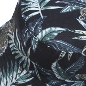 Double-sided bucket hat with tropical leaf print on durable twill cotton fabric