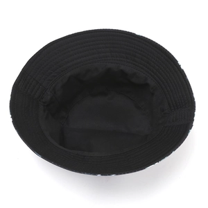 Inside view of black cotton bucket hat with pineapple print and neat stitched lining