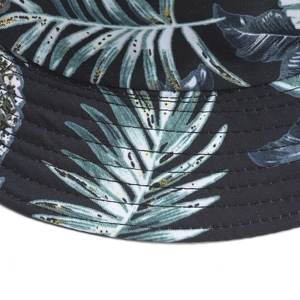Reversible tropical leaf print bucket hat in black with detailed stitching and wide brim
