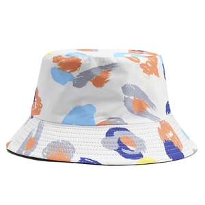 Close-up of bucket hat fabric showing colorful abstract prints and stitching detail
