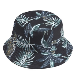 Double-sided sun hat with tropical pineapple and green leaf prints on black canvas